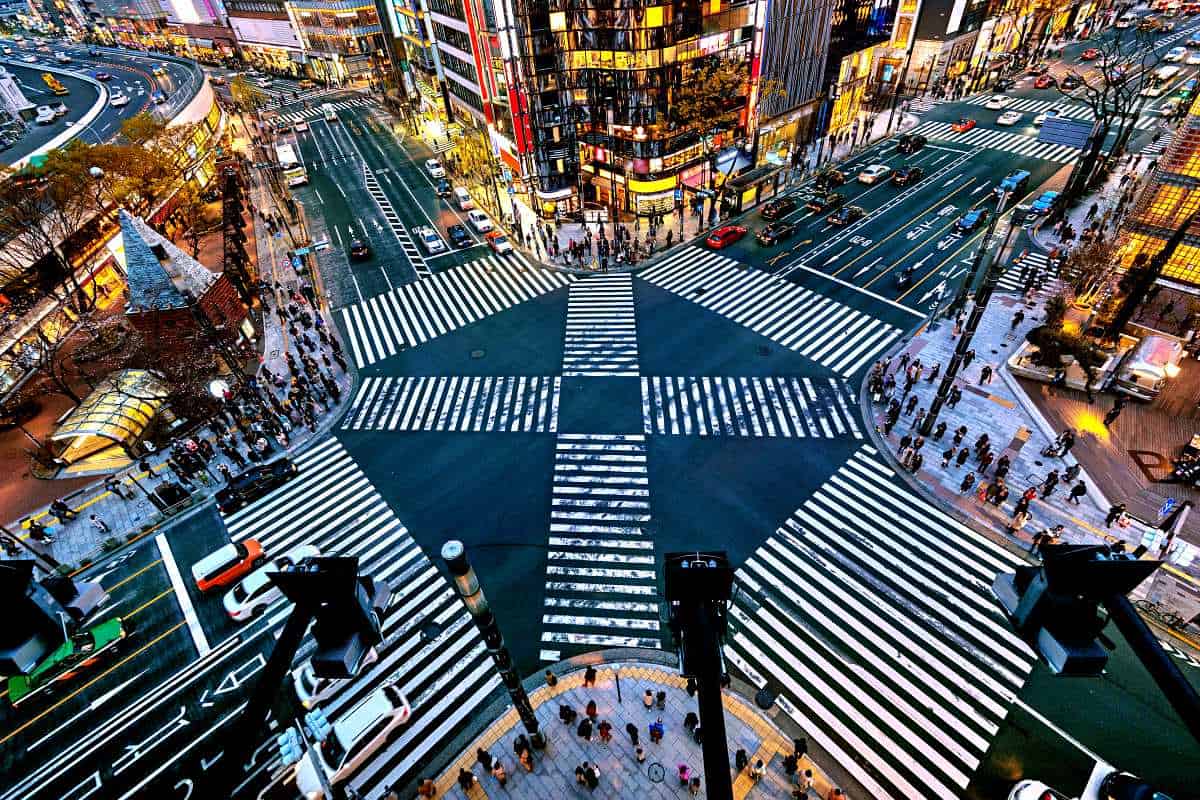 Shibuya crossing Tokyo aerial view at night with neon lights